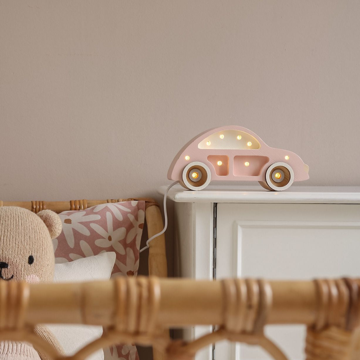 Little Lights pink Mini Beetle Car night light on a dresser in a girl's room