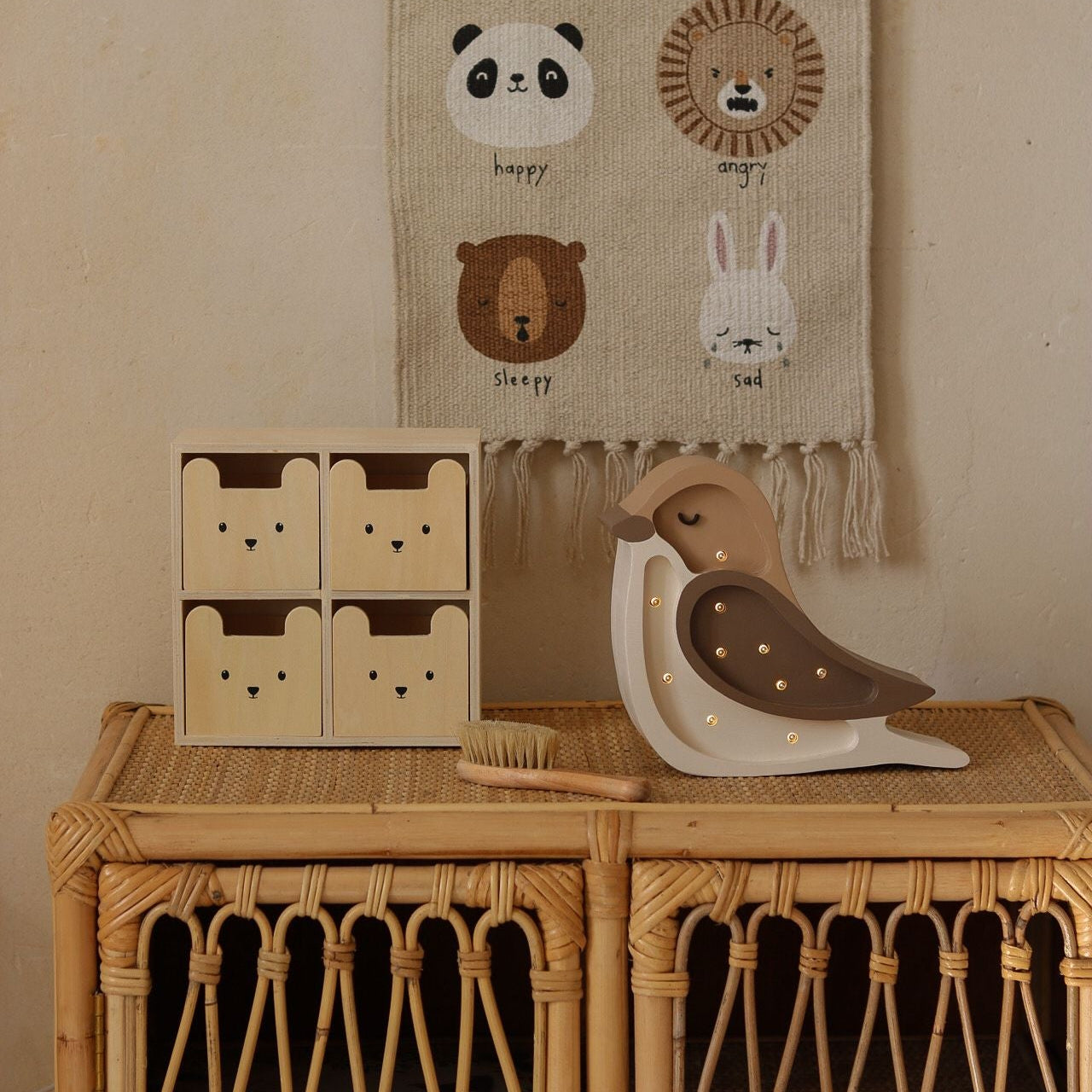 Little Lights Mini Bird beige night light on a dresser in a baby room