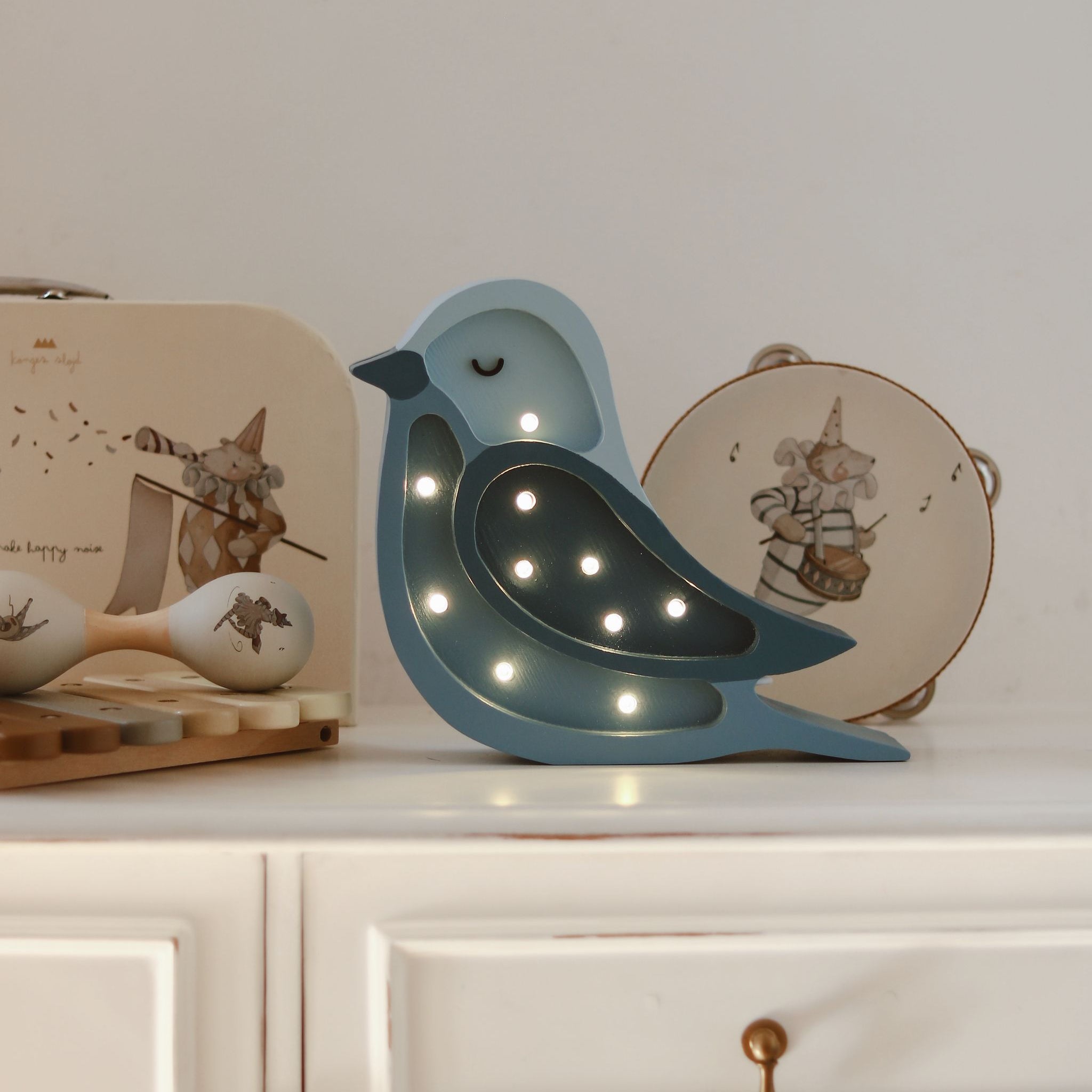Little Lights Mini blue bird lamp in a baby nursery
