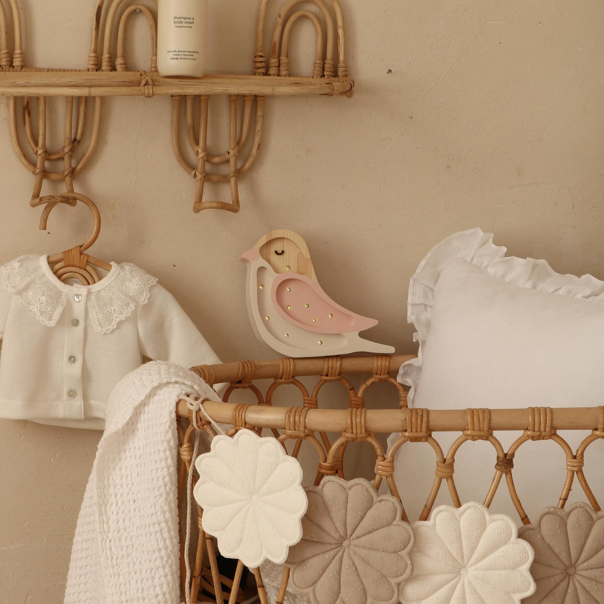 Little Lights pink Mini Bird Lamp by a baby crib in a girl's nursery