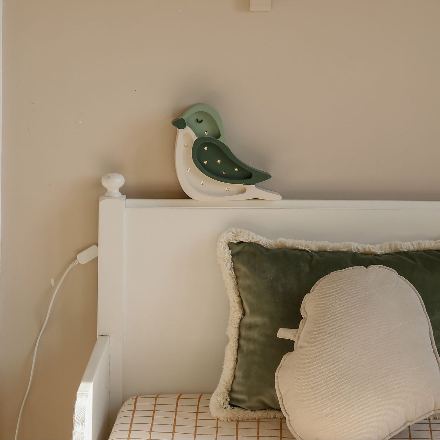 Little Lights green Mino Bird Night Lights by the bed in a kids bedroom