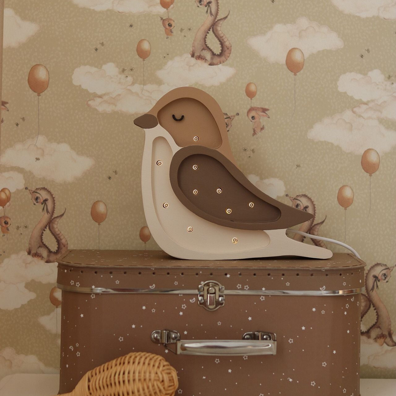 Little Lights Mini Bird Coffee Beige dimmable lamp in. a baby nursery