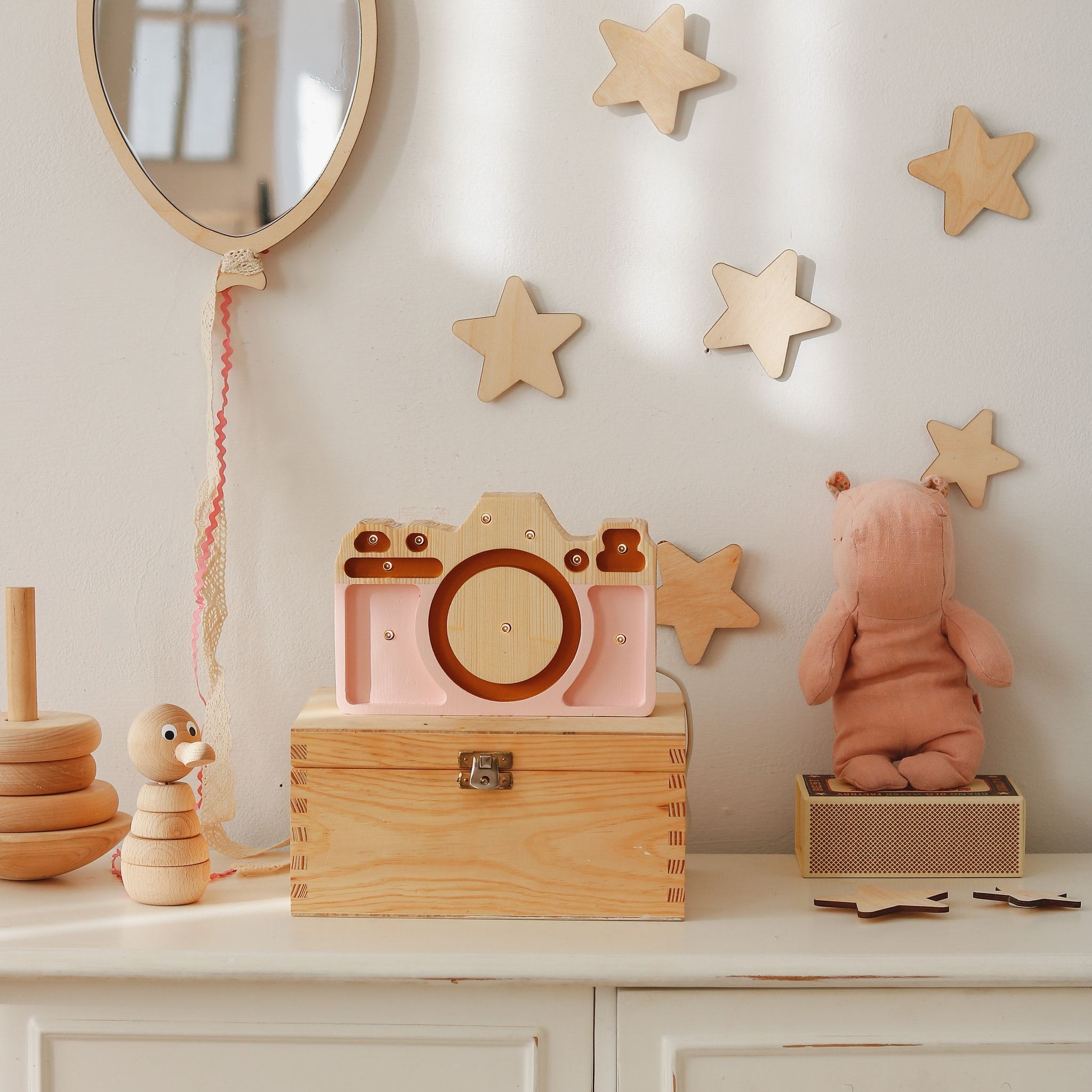 Little Lights Handmade Dimmable Mini Camera pink lamp on a dresser in a baby girl nursery