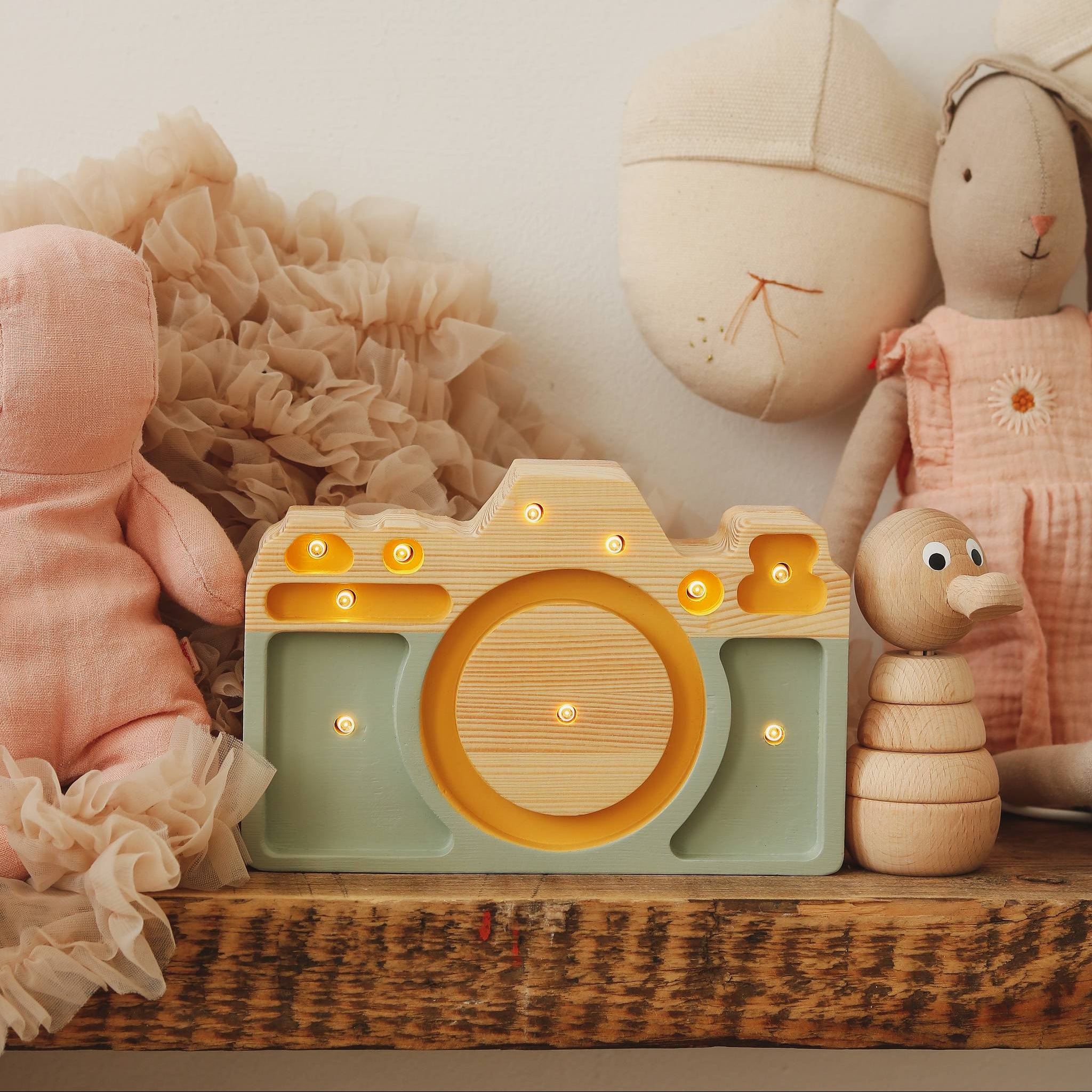 Little Lights Wooden Mini Camera ight Lights on a shelf in a kid's room