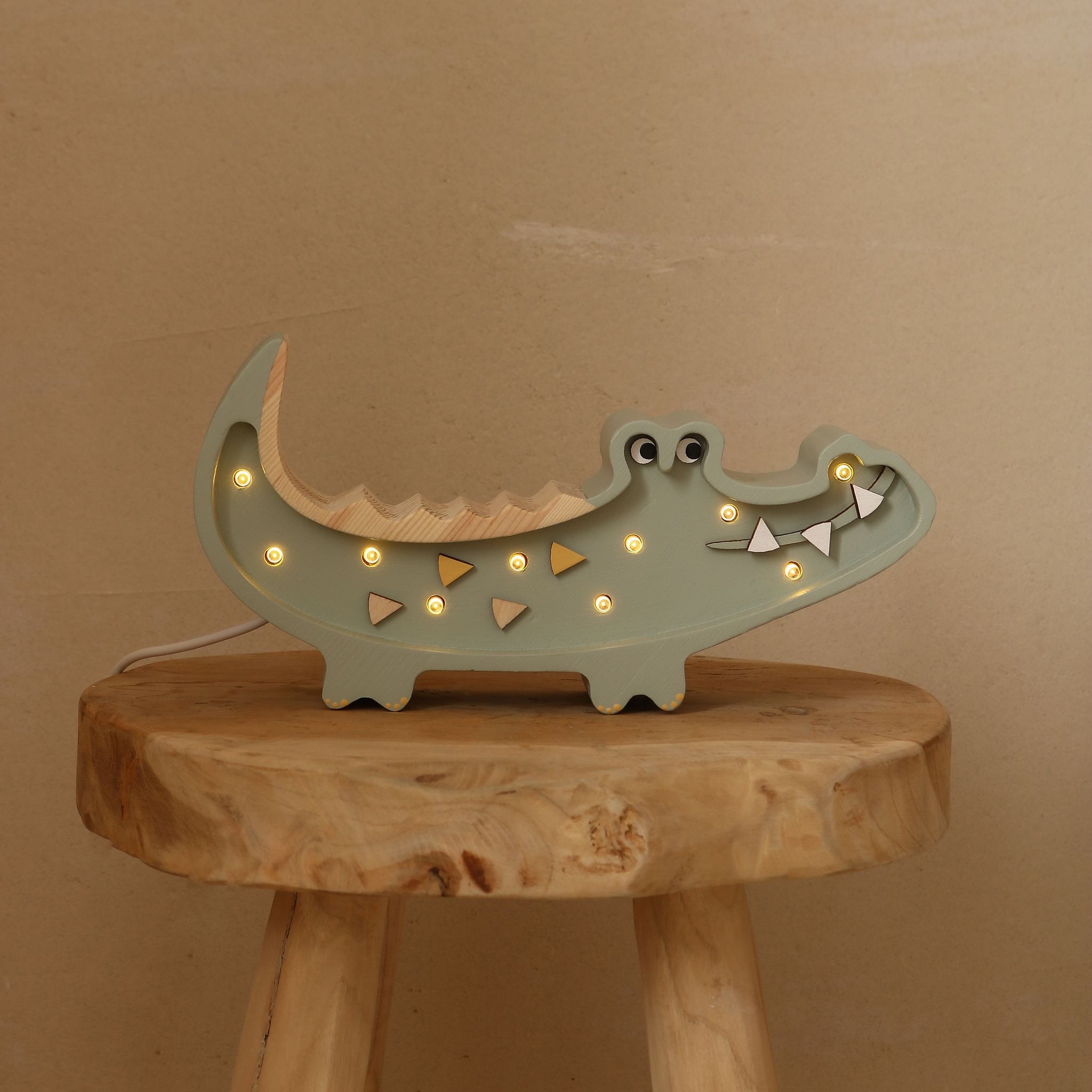 Little Lights Mini Crocodile night light in khaki in a baby nursery