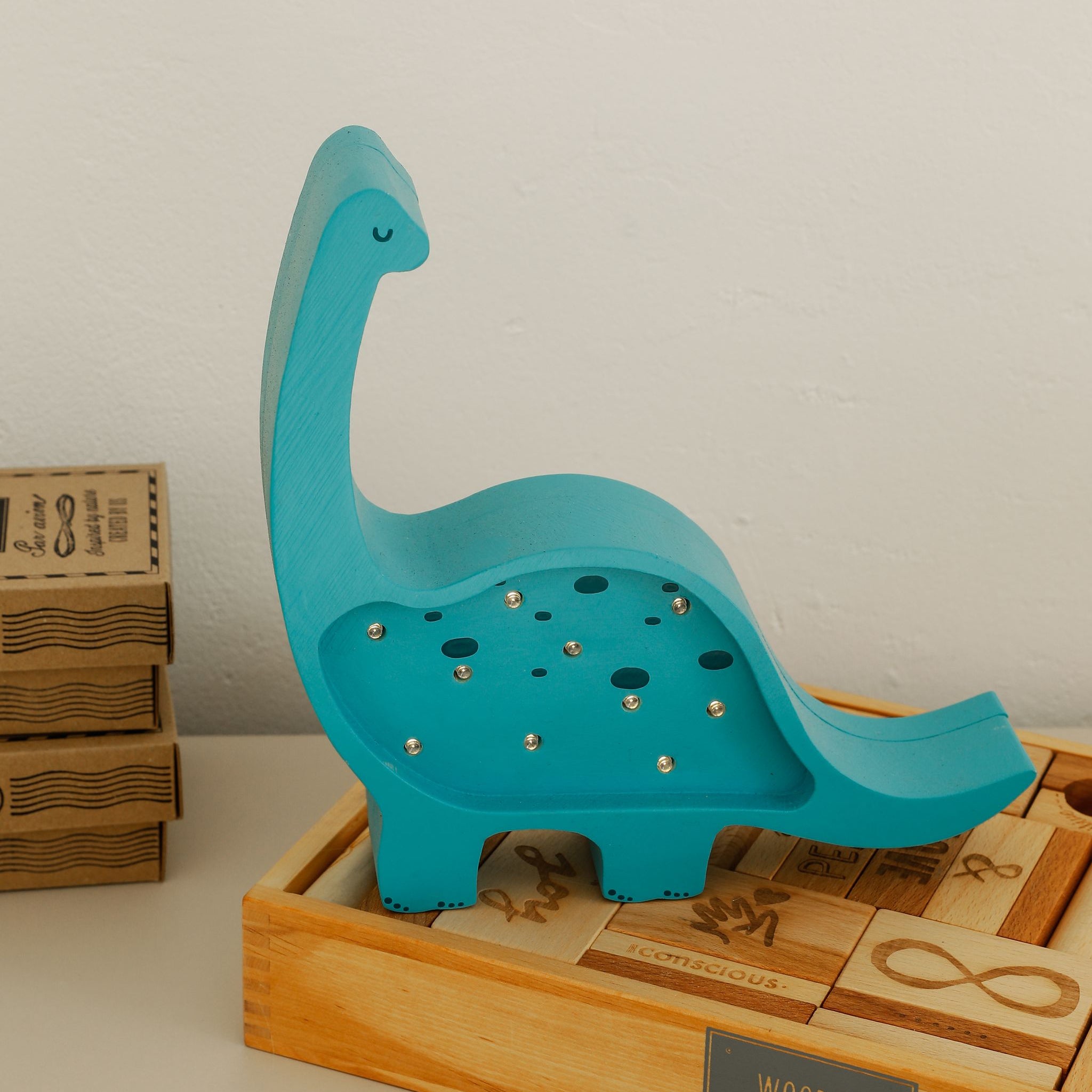 Blue Mini Dinosaur Lamp in a kids room
