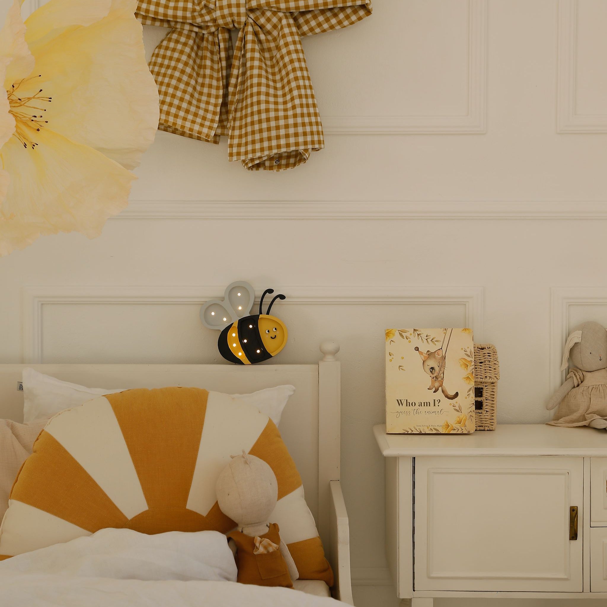 Little Lights Mini Happy Bee lamp by the bed in a girl's room