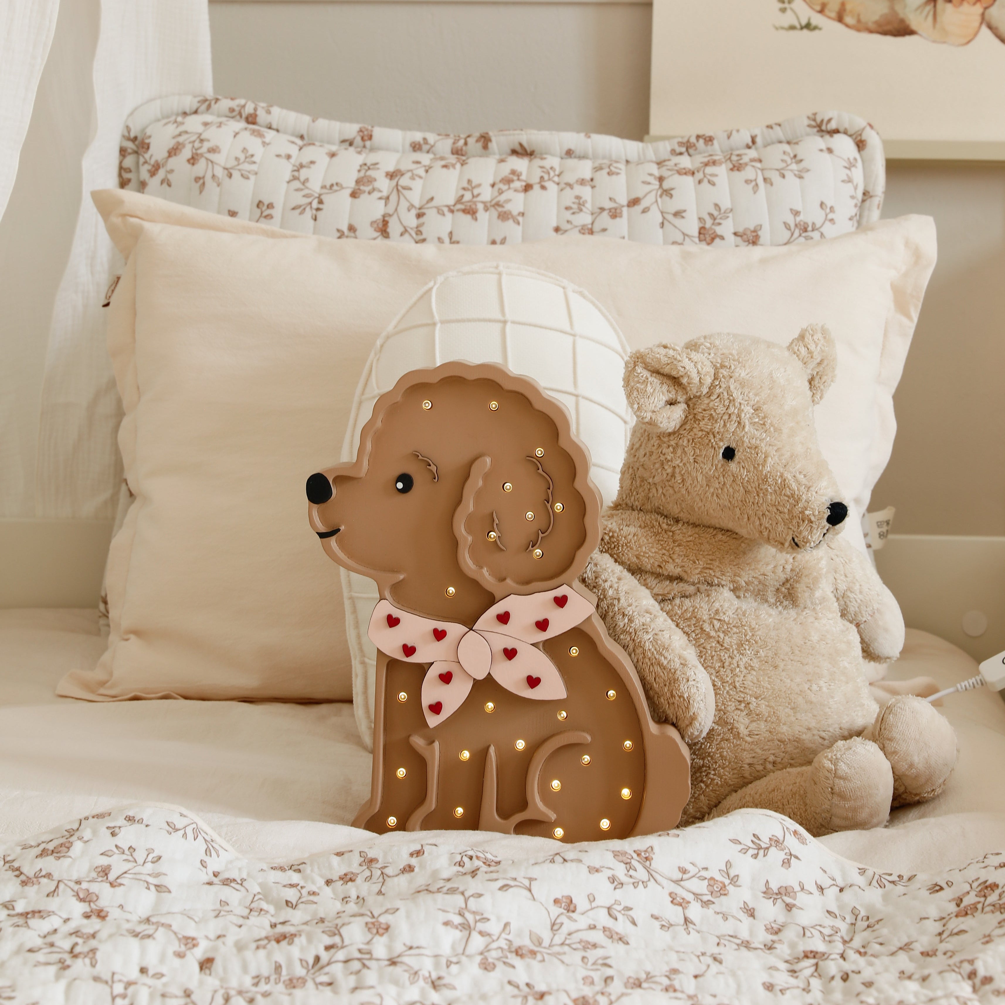 Cozy girls room with the Poodle Dog night light on the bed next to a teddy bear
