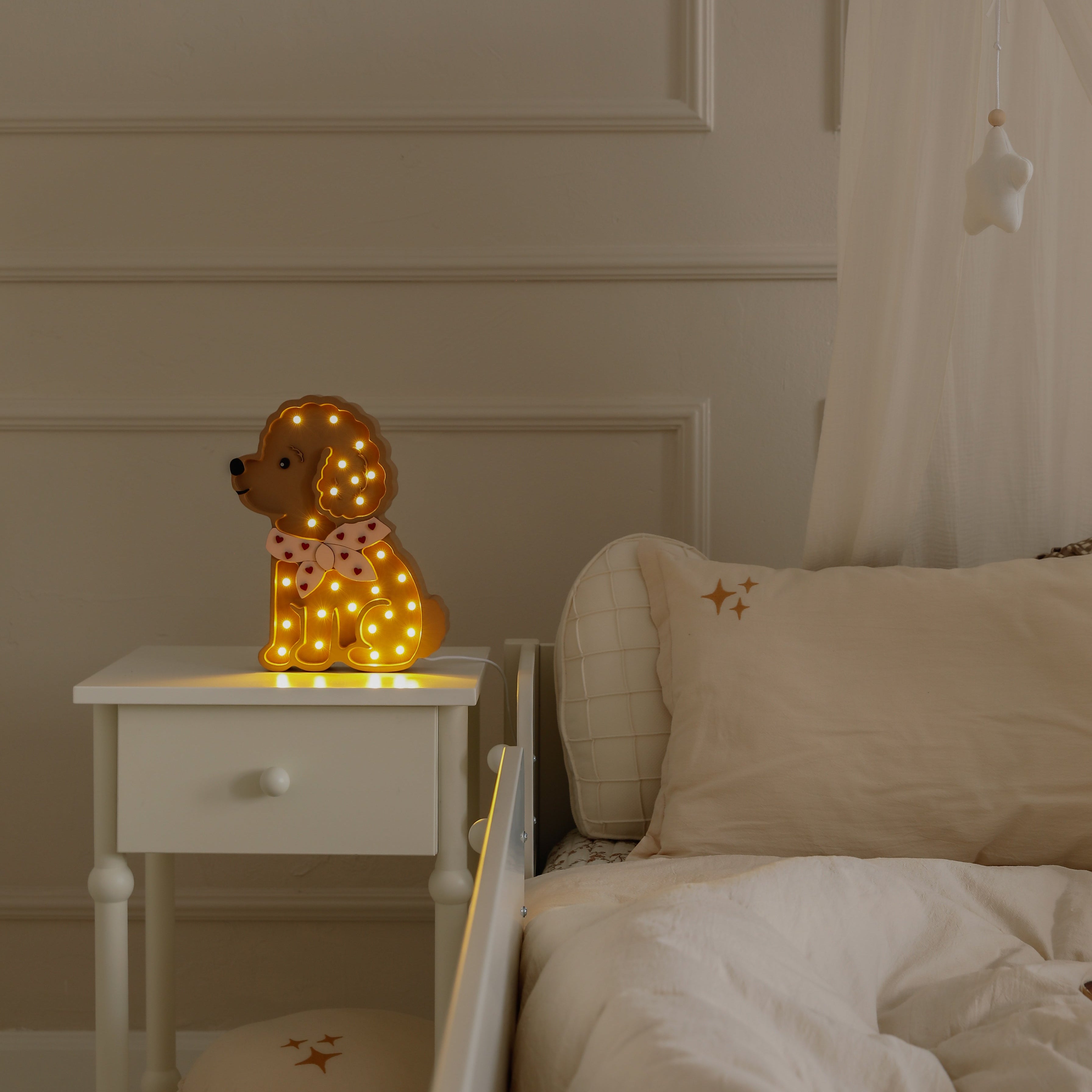 Little Lights brown Poodle dog lamp glowing softly in girl's room by the bed