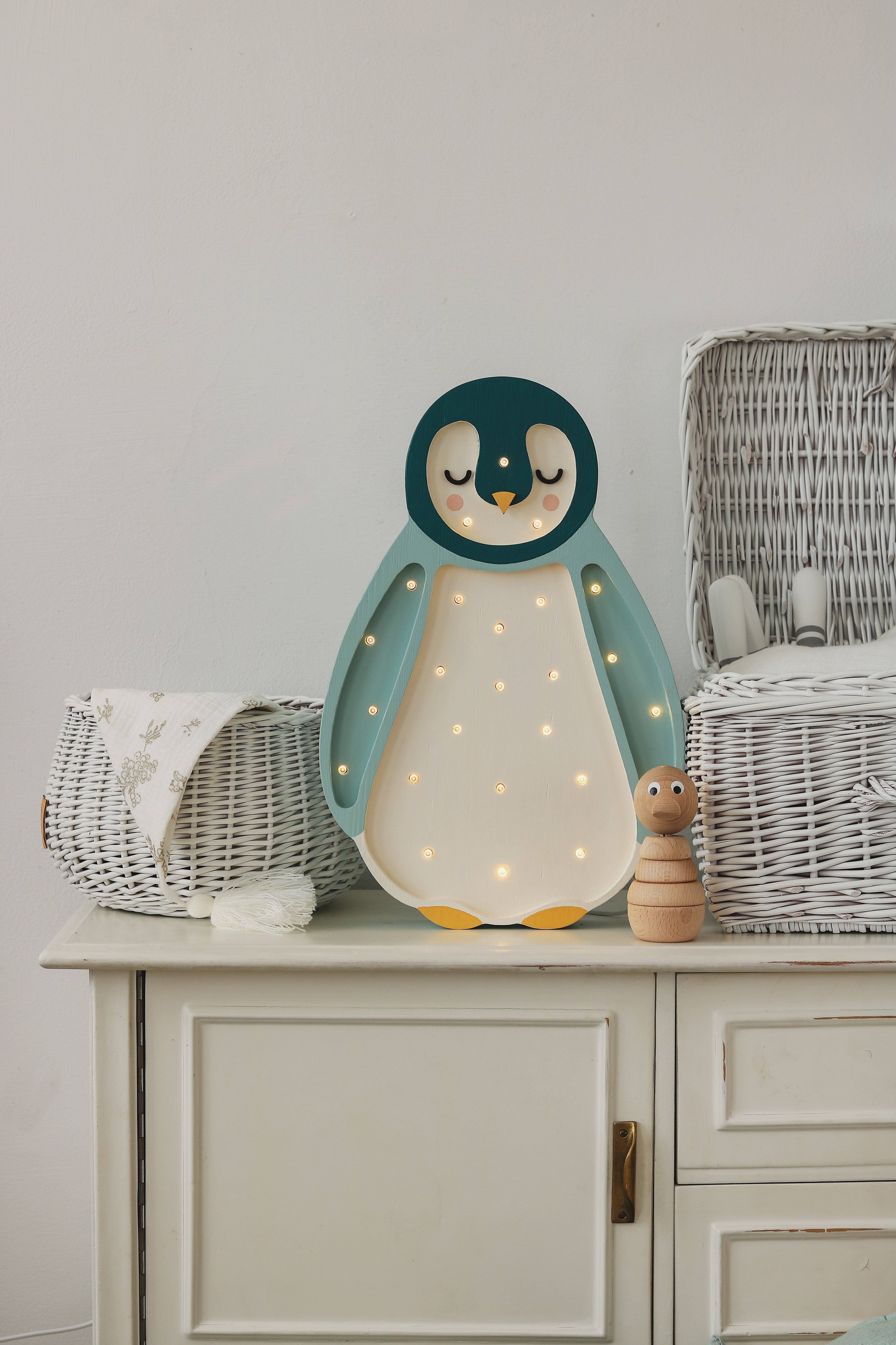 Handmade teal penguin lamp by Little Lights, wooden dimmable LED nursery night light.